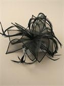 Large black looped organza fascinator with feather tendrils set on a clear comb. Ideal for weddings or any other special occasion.
