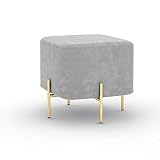 Con su asiento de tela suave al tacto sobre brillantes patas de metal con acabado dorado, esta pieza no solo es una pieza de moda moderna, sino también cómoda.
