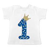 La camiseta para bebé hecha de suave y esponjosa algodón 100% (moteada con 5% de viscosa) y broches de tono sobre tono en el cuello para que no se le quiten el pelo, convencida por su gran calidad
