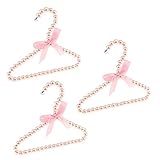 Gut aussehend: Dieser luxuriöse Kleiderbügel verleiht Ihrem Baby oder Haustier Lieblingskleidung im Kleiderschrank.