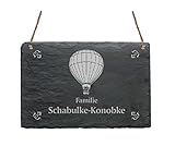 Motive und Texte werden mittels wetterfester Lasergravur auf die Schieferplatte gebracht