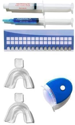 Non-peroxide teeth whitening light kit with remineralization gel to reduce tooth sensitivity and a shade guide to track the progress