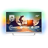 Lassen Sie sich fesseln von dem dreiseitigen Ambilight auf dem 49 Zoll TV. Freuen Sie sich auf ein noch intensiveres Fernseherlebnis.