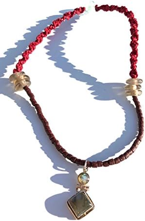 • Ethnos Barcelona - Silver pendant and double labradorite mounted with small terracottas.