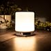 Produktbild All in One LED Beleuchtung | dimmbare 360° LED Lampe mit Touch Sensor | mit Bluetooth Lautsprecher Uhr/LED Anzeige Radio Weckfunktion | unters. SD-Karte, Sleep-mode, Hand frei Telefonat (warmweiß)