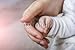 Produktbild Poster-Bild 80 x 50 cm: "New born baby hand", Bild auf Poster