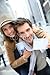 Produktbild Alu-Dibond-Bild 80 x 120 cm: "Tourists in Manhattan showing New York pass", Bild auf Alu-Dibond