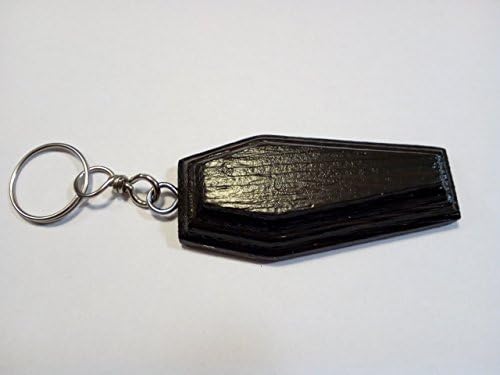 Coffin-shape rosewood-colored wooden keychain. Coffins like talisman, amulet