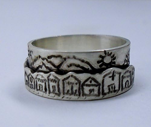 Silver ring with houses and landscapes engraved on two levels. With custom text inside.