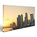 Produktbild Bild Bilder auf Leinwand Die Wolkenkratzer in der Skyline des Handelszentrums von Doha, die Hauptstadt des Arabischen Golflandes Katar bei Sonnenuntergang. Verschiedene Formate ! Direkt vom Hersteller ! Bilder ! Wandbild Poster Leinwandbilder ! FWF
