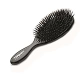 Cepillo de pelo con cerdas naturales elaborado con fibra de jabalí y madera tratada para proporcionar al cabello suavidad y protección