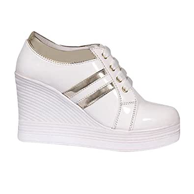 white shoes with golden stripes