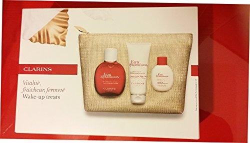 Clarins Eau Dynamisante Moisturizing Body Milk/Shower Gel/Eau Dynamisante spray/Toilette Bag Set - Pack of 4