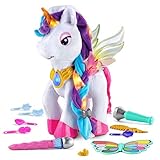 Ein magisches Einhorn, das leuchtet. Interaktiv sprecht, singt und ändert die Farbe, wenn man Make-up mit dem magischen Pinsel auftragen kann.