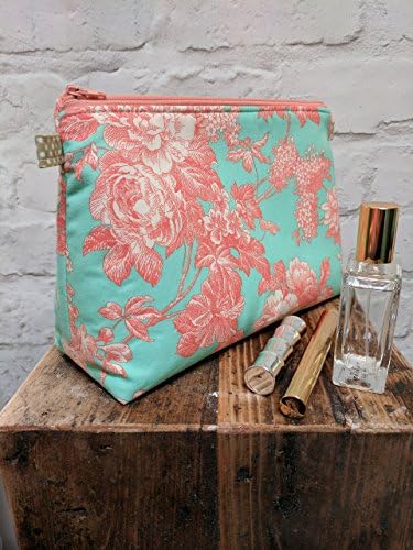 Floral Make Up Bag / Cosmetic Bag / Wash Bag. Made using pretty turquoise/cream/peach floral print fabric. 25cm(10")Wide, 18cm(7")Tall by 10.5cm(4")Deep. Handmade in Dorset UK