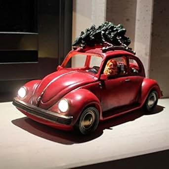 Santa Driving Vintage Beetle Car Lit With Christmas Tree On Roof