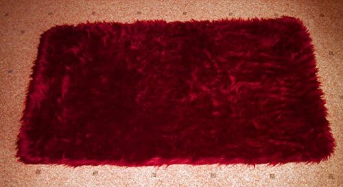 Classic Arran faux fur rug Ruby Red 130cm x 70cm (long pile)