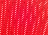 tela de polialgodón rojo con pequeños lunares blancos. 1 m x 112 cm para costura y colchas.