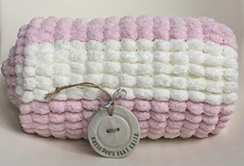 Hand knitted baby blanket in rose pink and cream stripes in Rico pom pom pompon marshmallow yarn
