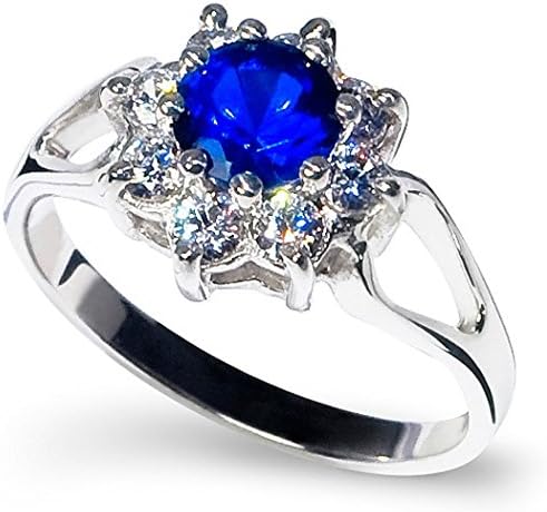 Cluster Sterling Silver Ring Eight Round Brilliant Cut Cubic Zirconia in a Claw Setting to Split Shoulders with a 9mm Diameter Black Centrepiece Sapphire. Available in all sizes between G and Z+3
