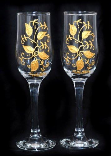 Pair of Champagne Flutes in Celebration Gold Leaf Design. Handpainted and designed in the UK by Beverley Gallagher, these significant and expressive gifts are ideal for Golden Wedding Anniversaries, Christmas, birthdays, civil partnerships, engagements, Graduations, Retirements and other special celebrations.