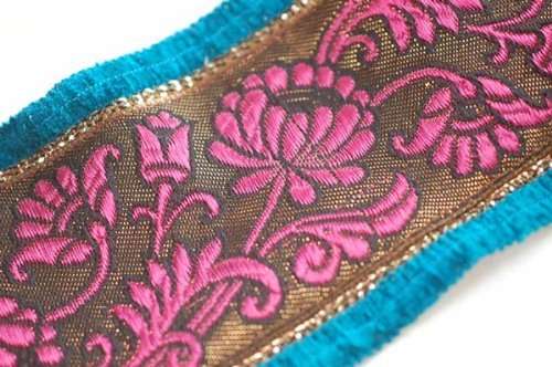 A floral brocade type deep ribbon border with a velour velvet selvedge edge in a contrast color. A traditional Indian sari border but usable for anything decoration; dressmaking, interiors or crafts. 9 cms deep. 2 superb colour combos. Sold by meter or by a complete Sari Border length of 9 meters