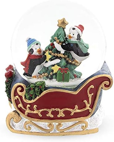 Penguin Sleigh Ride: Mini Water Snow Globe with Penguins Decorating Tree