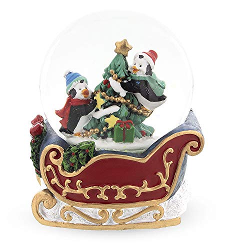 Penguin Sleigh Ride: Mini Water Snow Globe with Penguins Decorating Tree