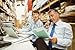 Produktbild Alu-Dibond-Bild 140 x 90 cm: "Manager working on laptop and talking on phone at desk", Bild auf Alu-Dibond