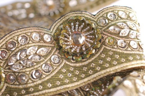 Embellished & Embroidery Indian ribbon, Traditional Sari Border. Sequins, beads , and stones rich hand embroidery on a jacquard Indian ribbon design. A Salwar Kameeze Border; Fabulous Cocktail dress Item! A Original design only available to Neotrims as part of its Special Embellished Trimmings collection for Dressmaking or Interior Decoration. This one is 5.5 cms deep in 3 fabulous colour options. Sold by meter or by a complete Saree Border length of 9 meters