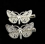 A pair of small butterfly hair clips fillagree style (both clips face to the left)