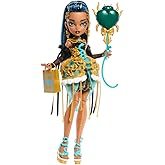 Monster High Altın rengi parti elbisesi giyen Cleo De Nile bebek ve davetiye, balon, hediye ve ruj gibi temaya uygun aksesuar