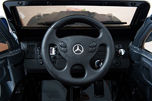 Kinder-Elektroauto Mercedes G AMG, schwarz lackiert, original lizenziert, batteriegetrieben, zwei Motoren, 12 V Akku, Fernbedienung, Weiche EVA Räder