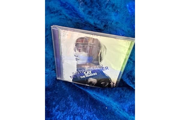 Never Say Never - The Remixes - Edition limitée (7 titres dont 5 inédits + Poster)
