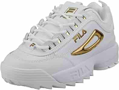 white and gold fila trainers