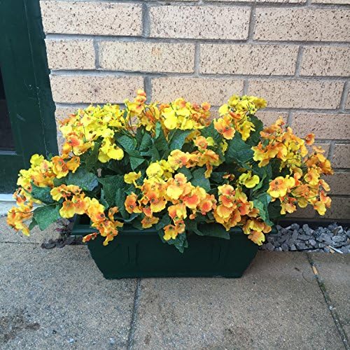 Artificial Flowers In Green Trough Out Door, Yellow Orange and Yellow Dancing Ladies Flowers ,