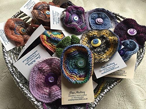 Hand-knitted round flower brooches, various colours, assorted sizes