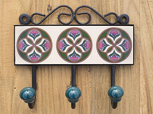 Three metal hooks with ceramic tile.Traditional Indian design.