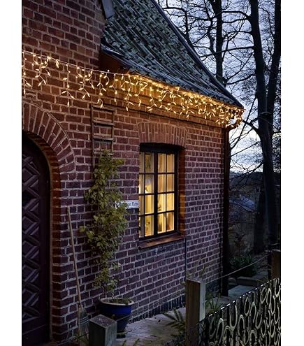 Konstsmide LED Solar sterren lichtgordijn, afstandsbediening, 77 amber diodes, buiten, transparante kabel, 2 x lithium batterij / 1 x CR2025 (incl.) - 4036-803SP