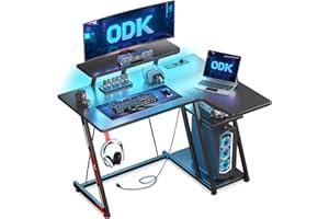 ODK Mesa Gaming 100x70 cm Esquina con Luces LED y Tomas de Corriente, Escritorio Gaming L con Soporte para Monitor, Mesa Gamer con Estante de Almacenamiento Fibra de Carbono Negro