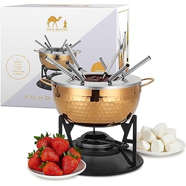 Ceramic Fondue Set With Silver Colored Forks Stock Photo - Alamy
