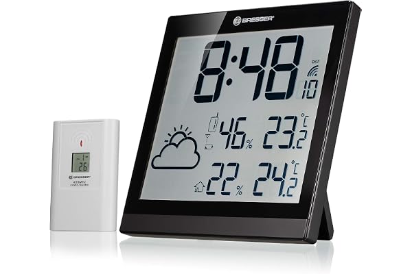 Bresser Horloge murale TemeoTrend JC avec station météo sans fil avec horloge radio DCF avec grand écran de température et d'humidité pour montage sur table ou au mur, avec indicateur des tendances météorologiques, noire | Provenance France. Emballage securisé. Livré avec Facture dont TVA.