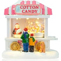 Villaggio di Natale innevato con Pista di pattinaggio TONDA e Pattinatori in Movimento su Laghetto, paesaggio con Luci LED e Musica Babbo Scenario Natalizio Parco Giochi Carillon 23x24x19cm