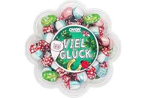 ‎OYOY 500g Glücksbringer aus Milchschokolade I ca. 65 Stück I Fair Trade Kakao I in einer 'Viel Glück'-Geschenkbox I Dose in Blumenform I Ideal um einen kleinen Gruß zu senden